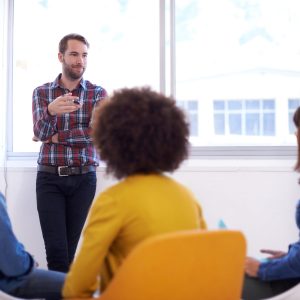 Explanation is an artform. Shot of a group of coworkers in a meeting.